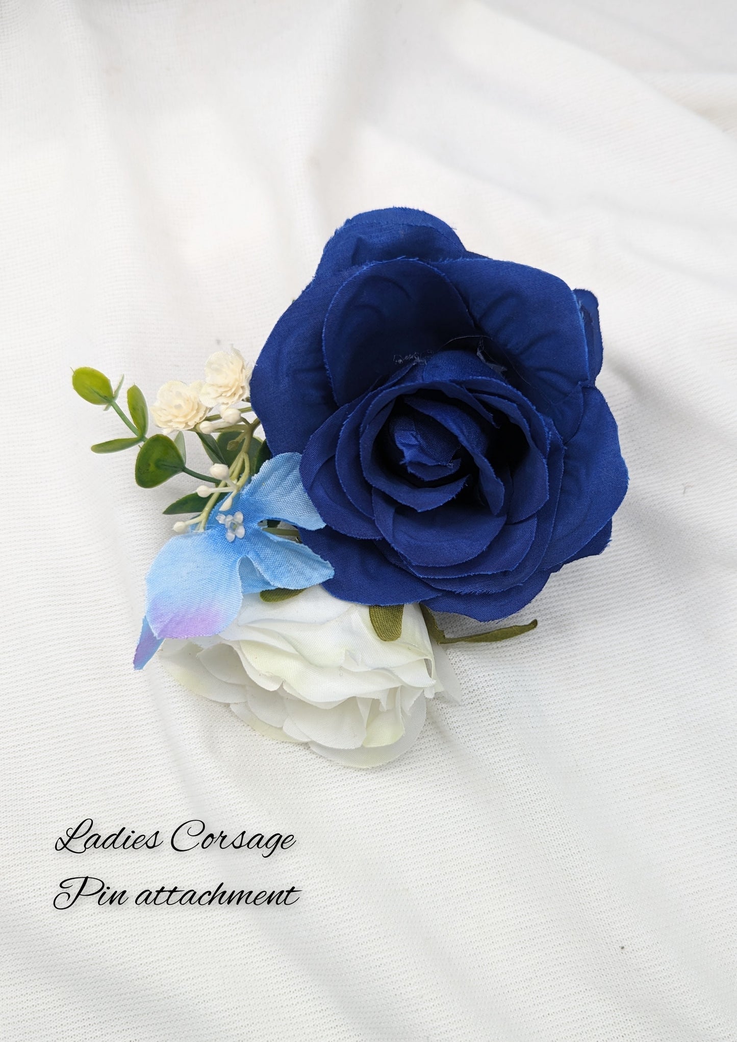 Blue and Ivory rose bouquet with hydrangea, gypsophila and eucalyptus. Ladies Corsage 