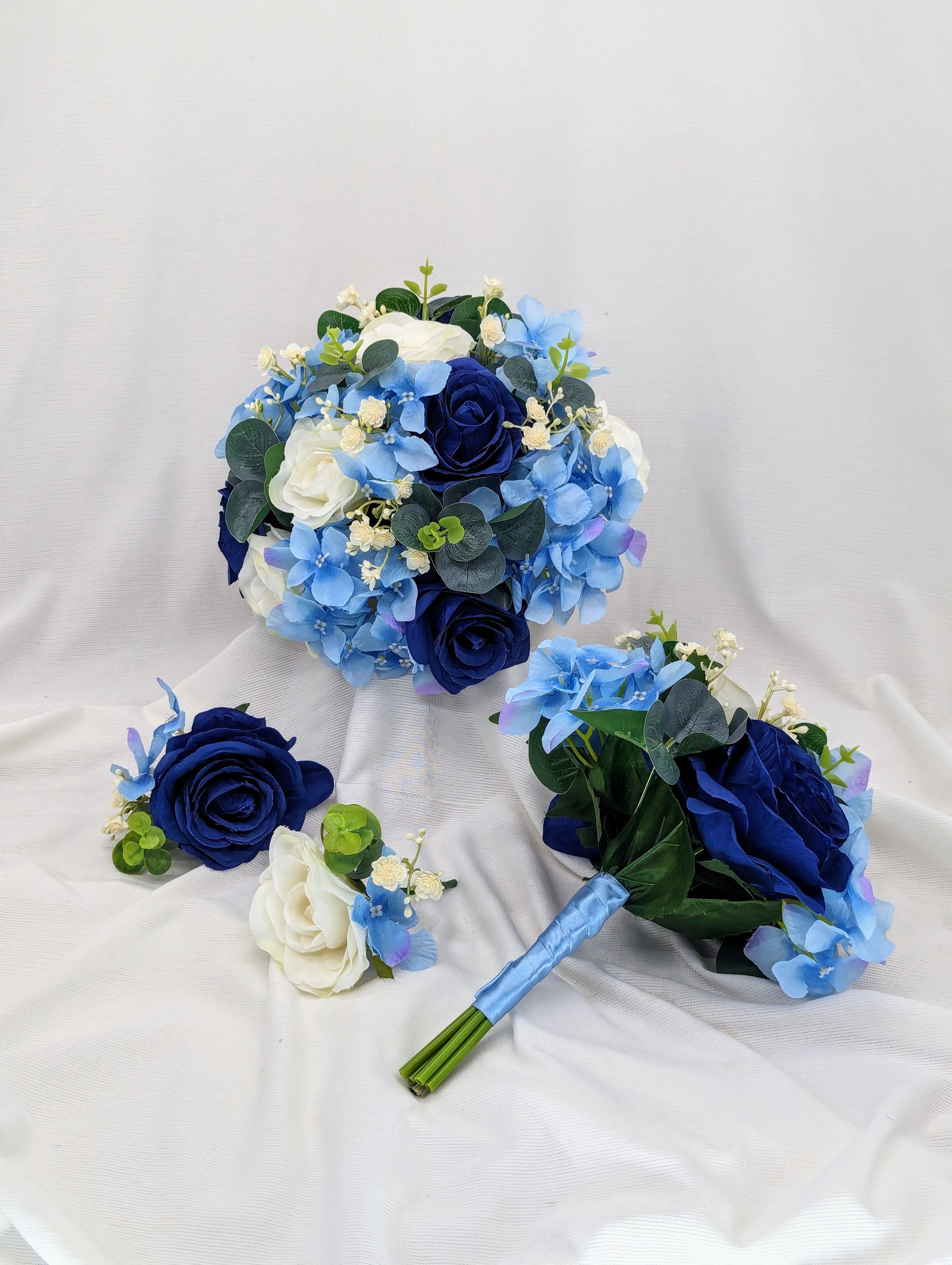 Blue and Ivory rose bouquet with hydrangea, gypsophila and eucalyptus. Wedding flowers 