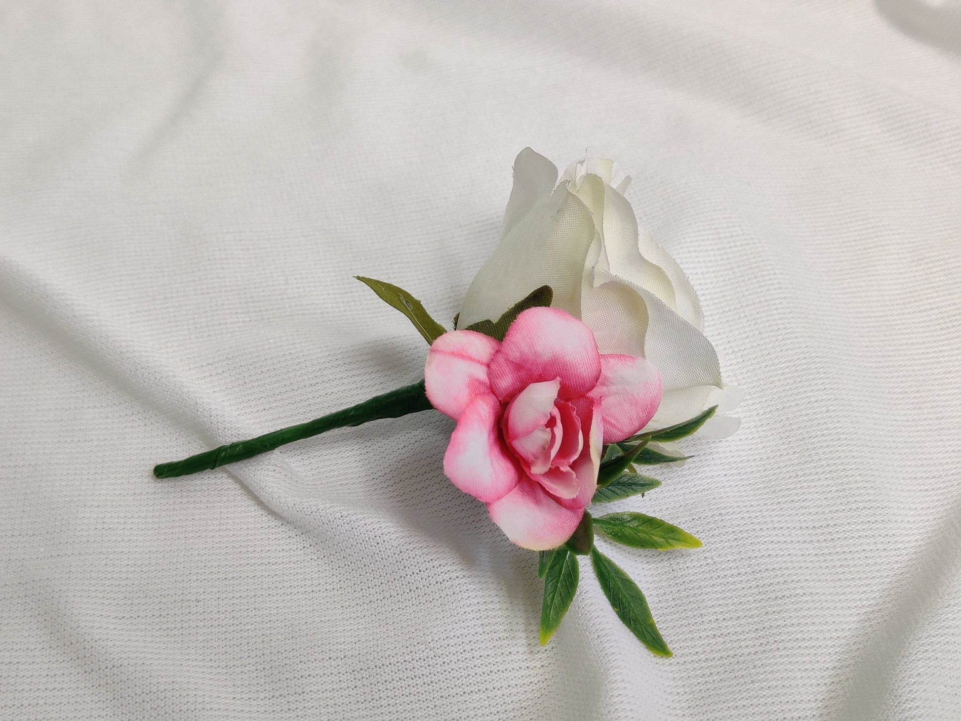 Pink and ivory rose wedding buttonhole 