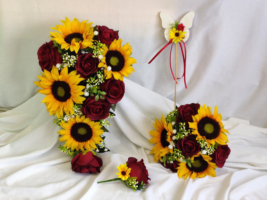 Sunflower, burgundy rose, gyp,berry and tealeaf wedding flowers 