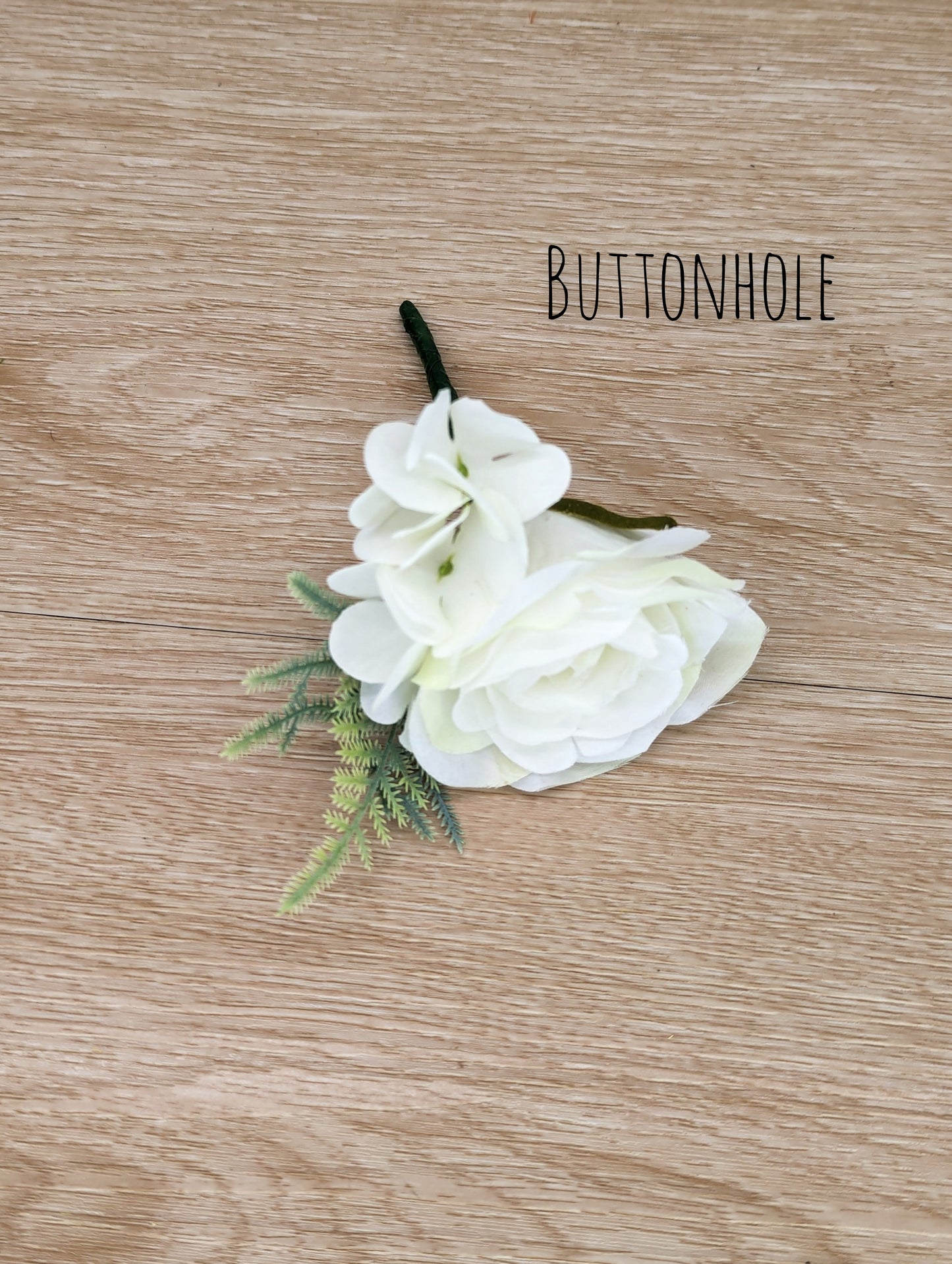 Ivory rose, hydrangea and foliage buttonhole 