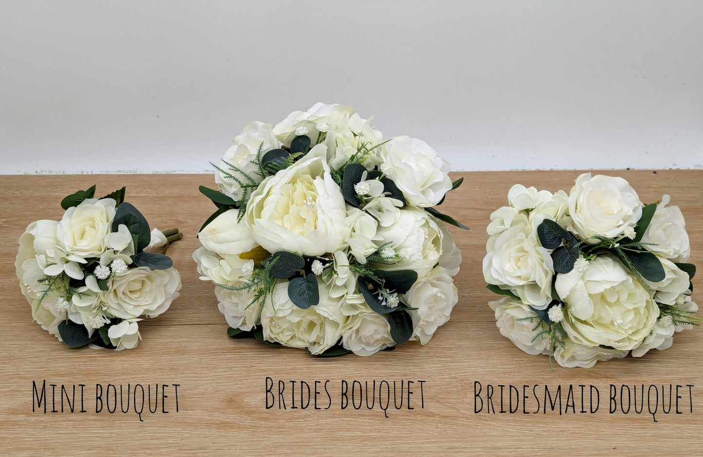 Ivory rose, peony hydrangea and foliage wedding bouquets