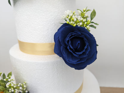 Sunflower, blue rose and foliage cake flowers and topper.