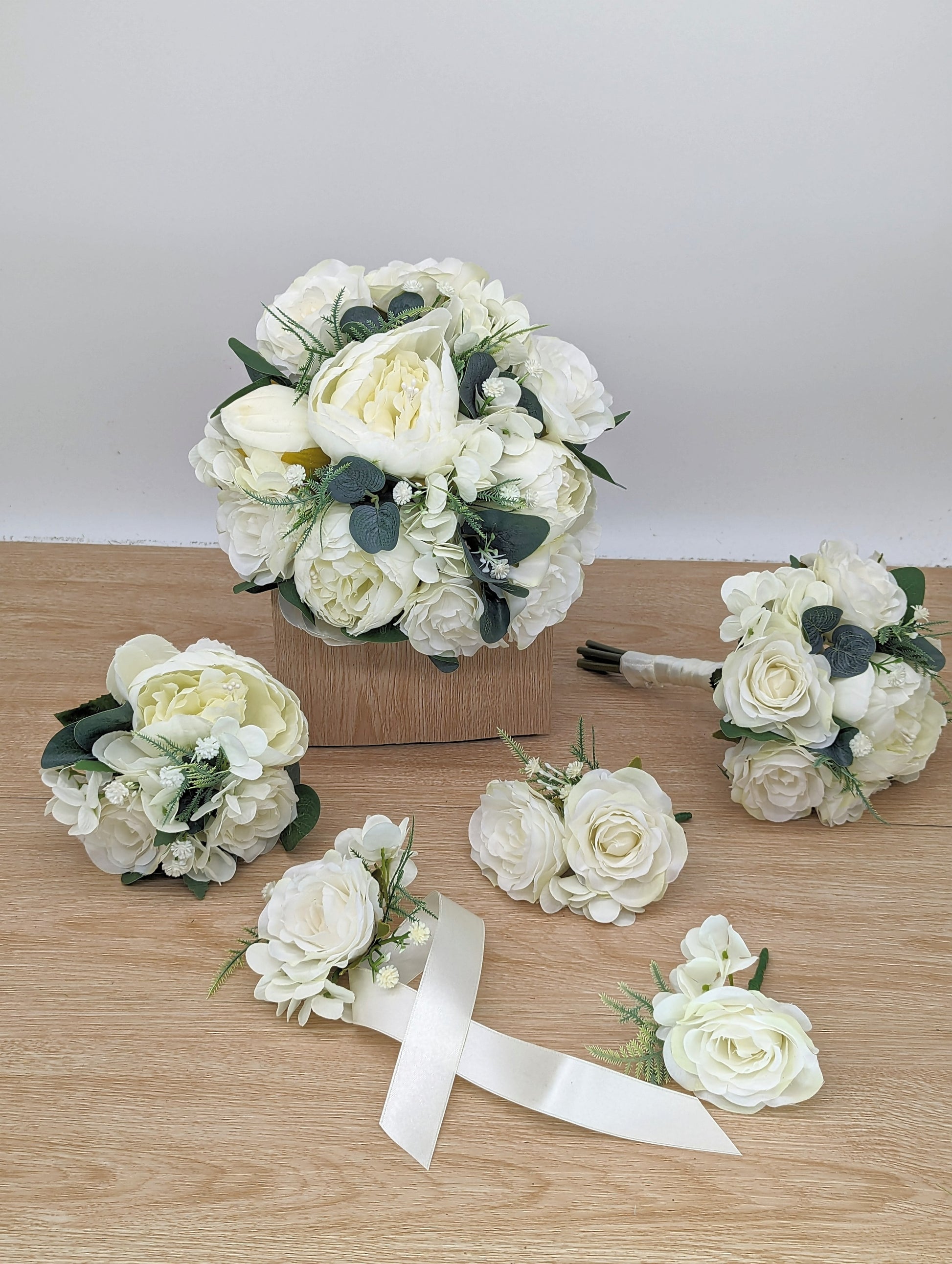 Ivory rose, peony hydrangea and foliage wedding flowers 