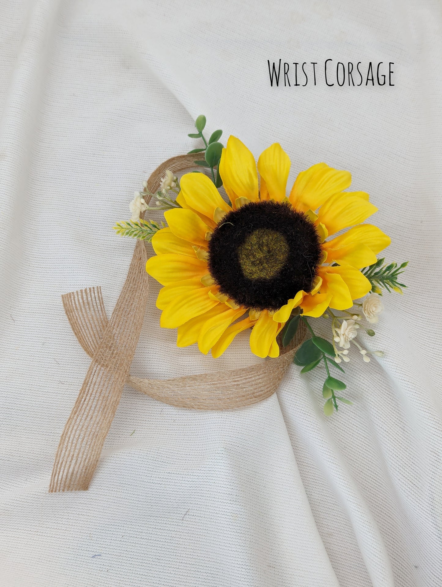 Sunflower, heather,gyp and eucalyptus wrist Corsage 